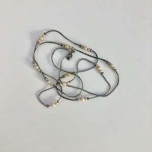Long vintage liquid silver necklace with cream faux pearls